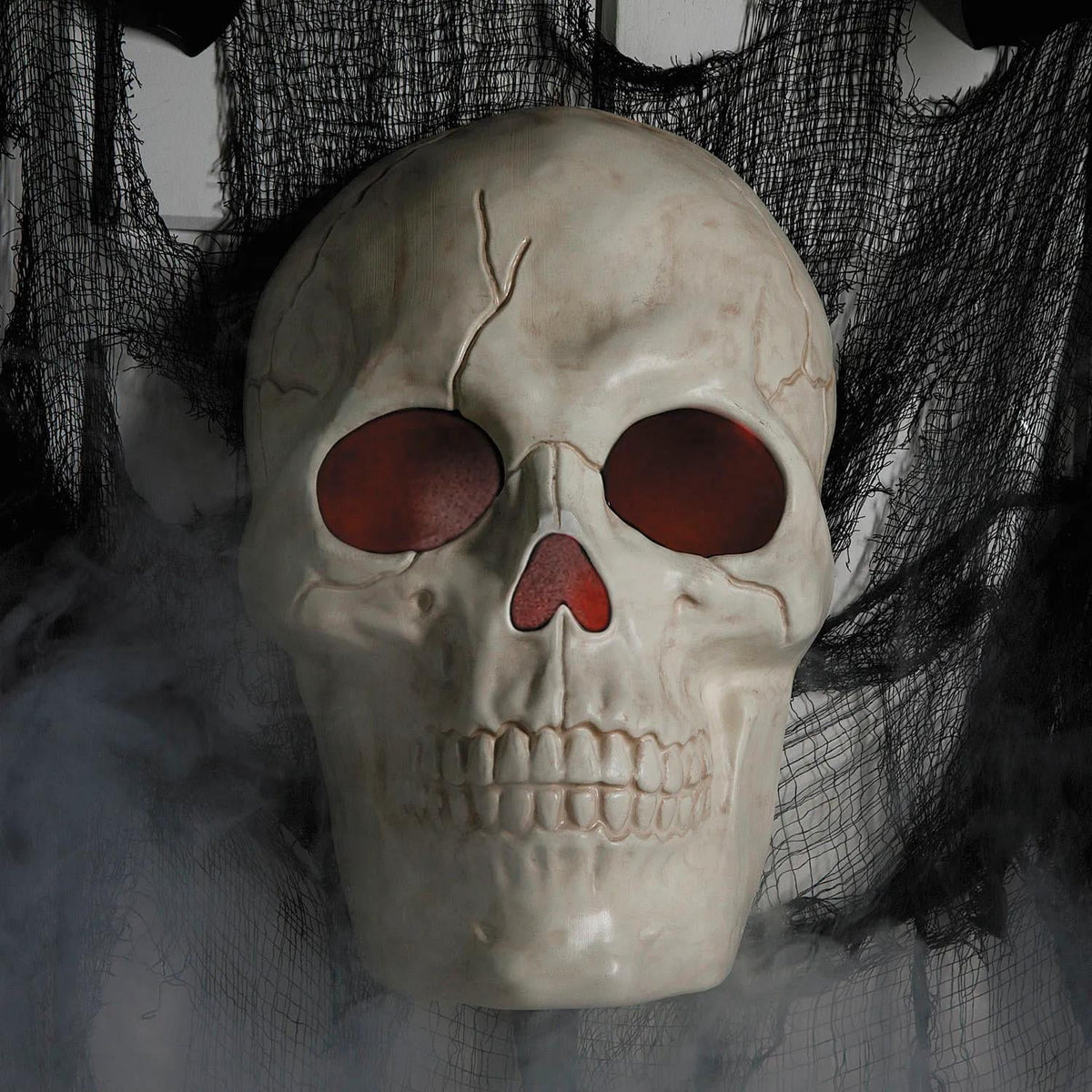 Witchwood™ 19 3/4" Giant Light-Up Plastic Skull Animated Prop Halloween Decoration