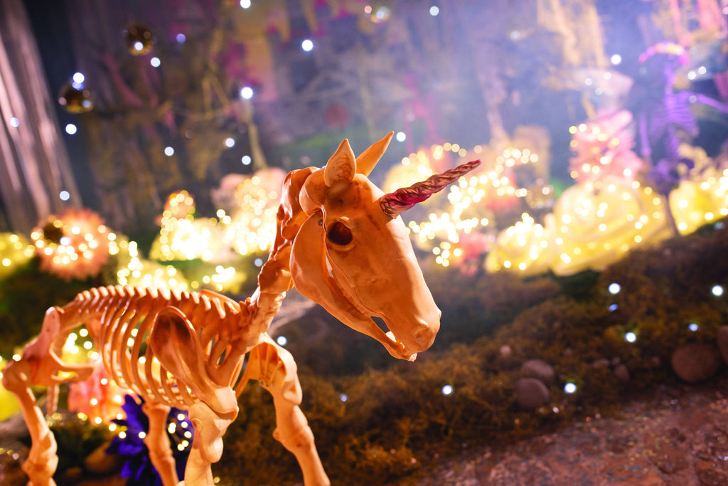 Witchwood™ Fun Express White Unicorn Skeleton Outdoor Decor, Halloween Macabre Design