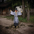 Witchwood™ 5 Ft. 8" Animated Head Turning Pumpkin Scarecrow Halloween Decoration