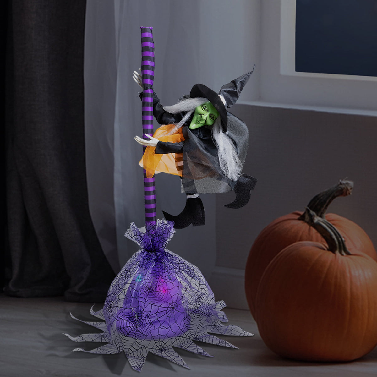 Witchwood™ Animated Flying Witch with Broom Halloween Decoration - 25"