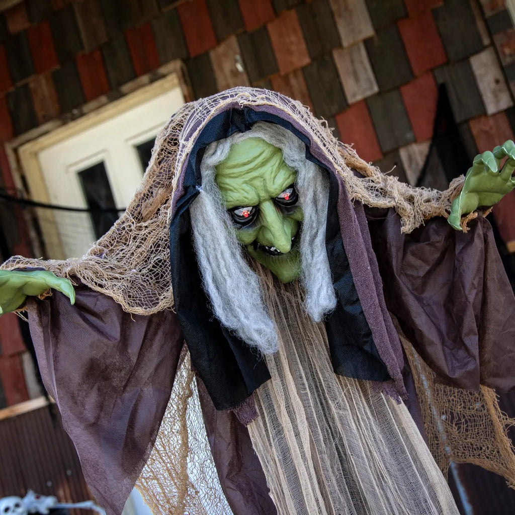 Witchwood™ 43 1/4" x 4 Ft. 9" Light-Up Hunchback Witch Standing Halloween Decoration