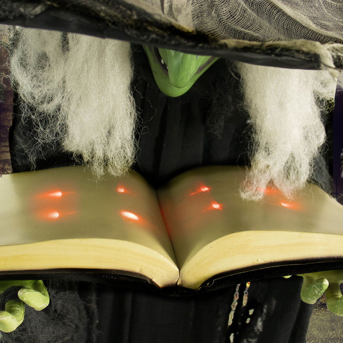 Witchwood™ 5.5 ft Poseable Witch with Spell Book, Lights and Sound, Indoor/Covered Outdoor Halloween Decoration, HHWITCH-9FLS
